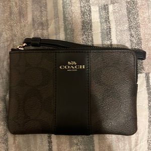 Coach wristlet in brown with the coach print